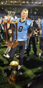 Monarchs Quarterback Will Arndt poses with the championship trophy and his Offensice Player of the Game award. Taylor Pope/Rogers Media