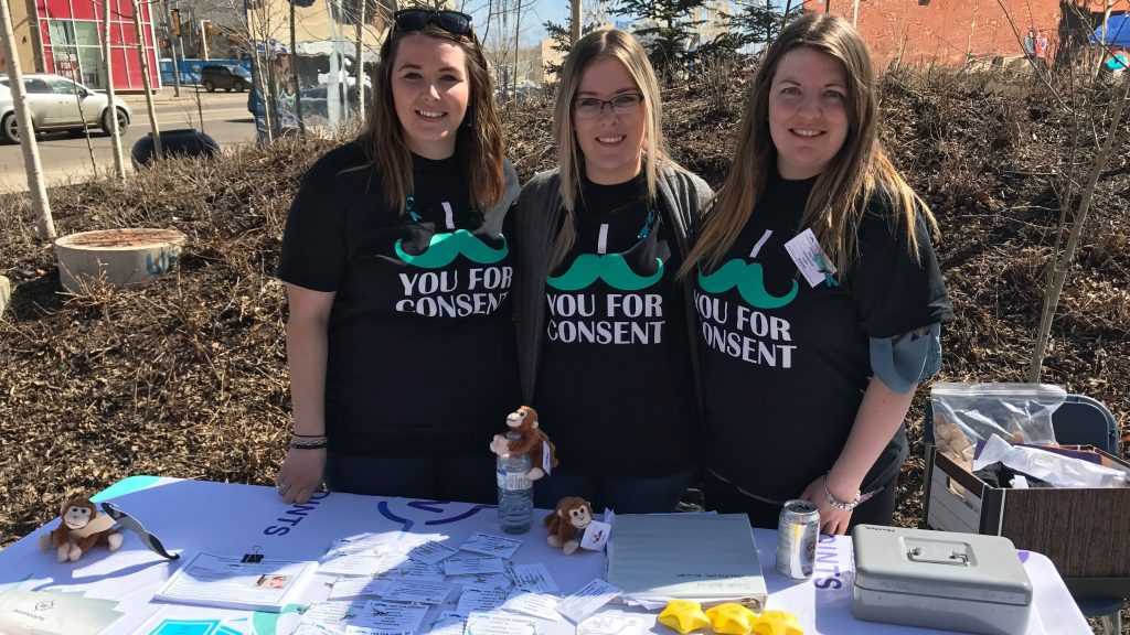 PHOTO. Members of Waypoints kicked off Sexual Assault Awarness Month with their "I mustache you for consent" campaign. Melanie Walsh. REPORTER