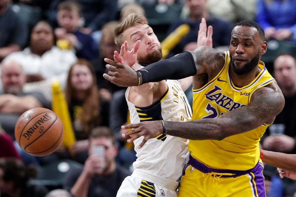 Los Angeles Lakers forward LeBron James (23) makes a pass in front of India...